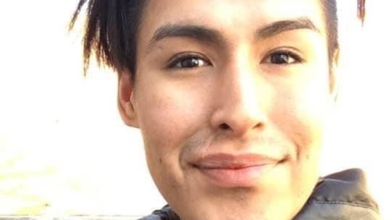 Portrait of smiling young man in smart jacket.