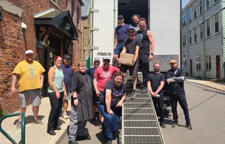 group of people and a truck