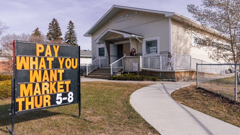 A black sign outside the Meadowlark Park Community Association reads, 