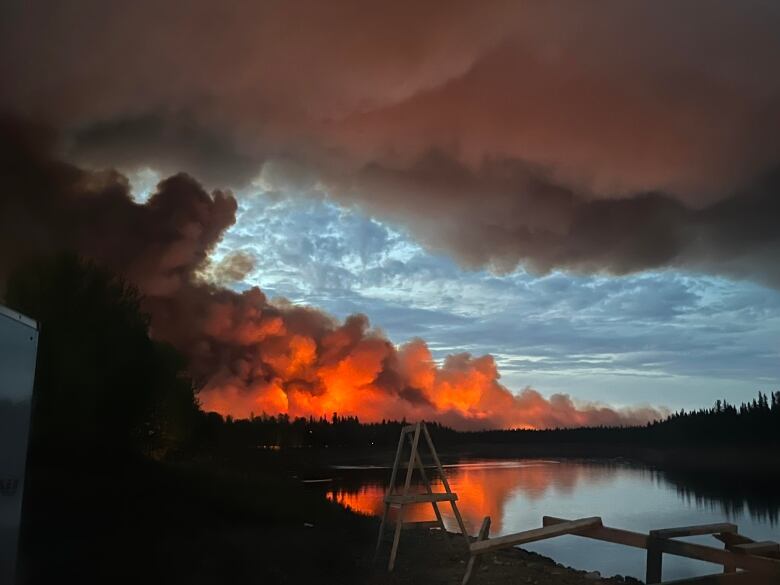 Flames, smoke, trees and water.