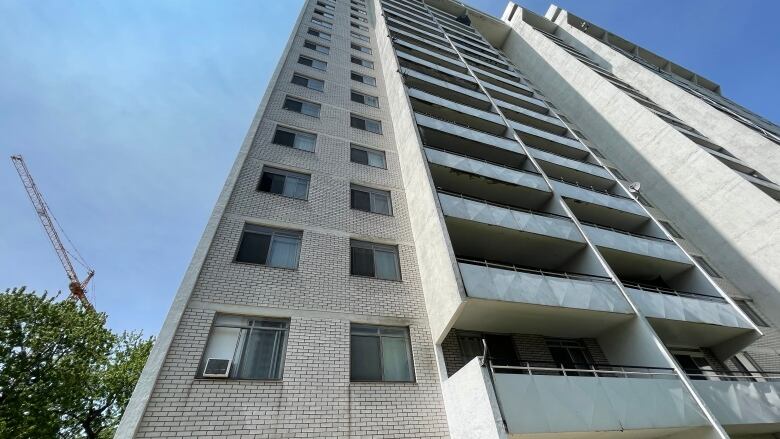 Apartment building with AC unit in window