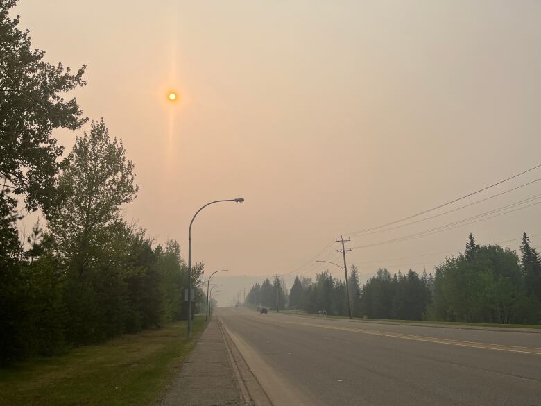 Hazy skies over a road.