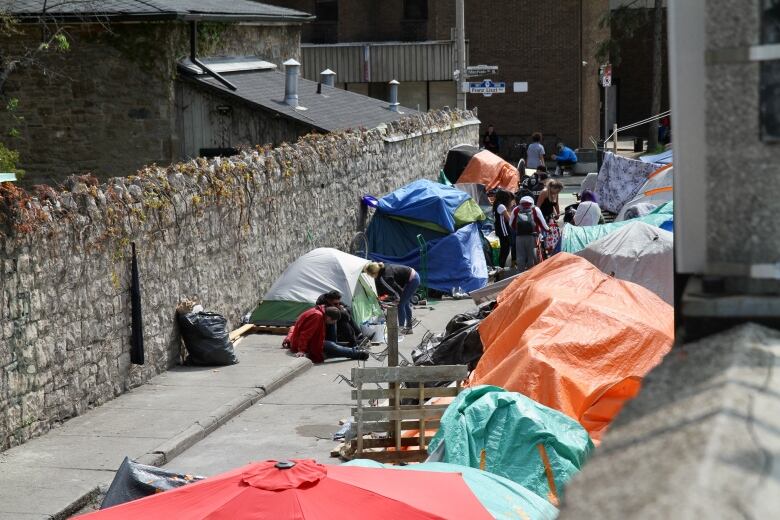 tents lined up on laneway