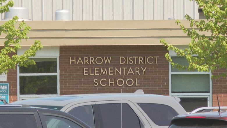 A brown building with the words Harrow District Elementary School on it.