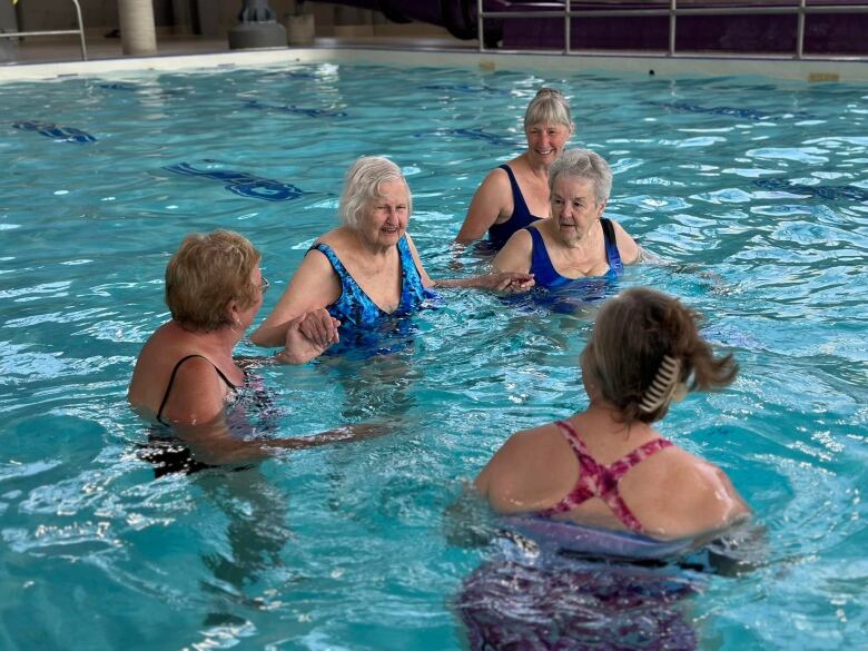 Barbara Edwards, 100, participates in an aquafit class at a pool in London, Ont.