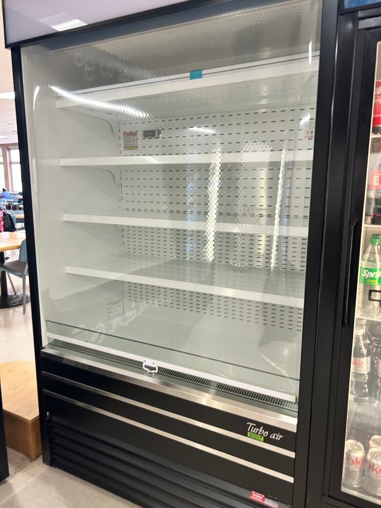 A cafeteria cooler at Foothills Hospital is entirely empty