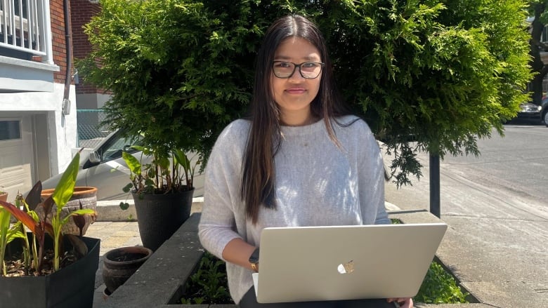 woman sitting with laptop