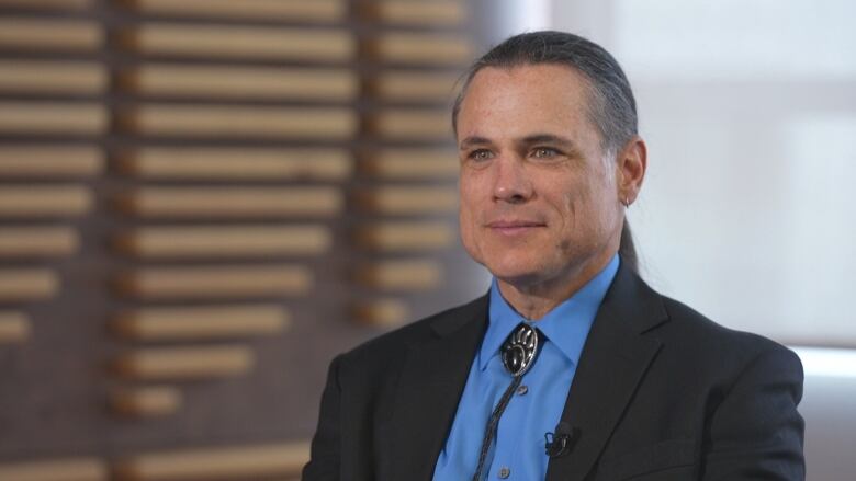 Senator Patrick Brazeau is seen sitting during an interview.