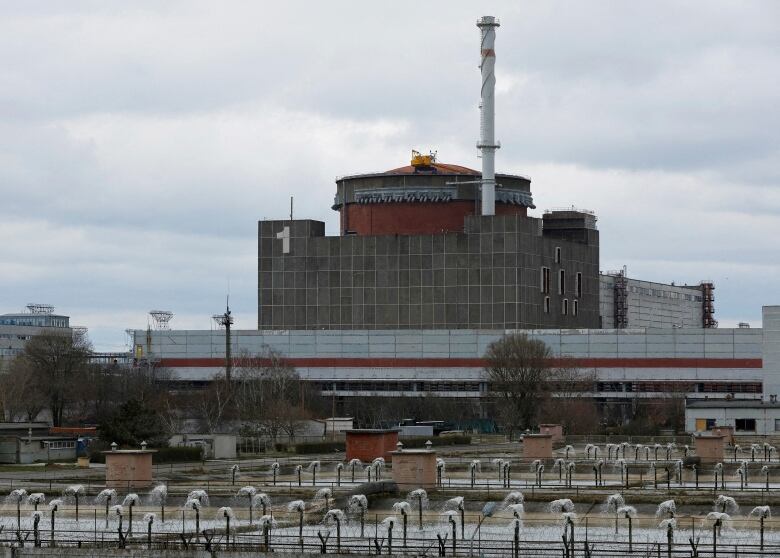 A grey building with a white chimney at a nuclear power plant in Ukraine.