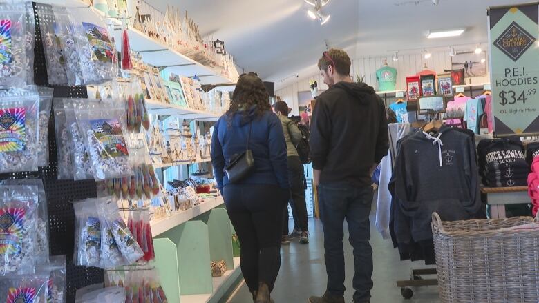 Customers look at clothing and souvenirs in one of the Cavendish stores. 