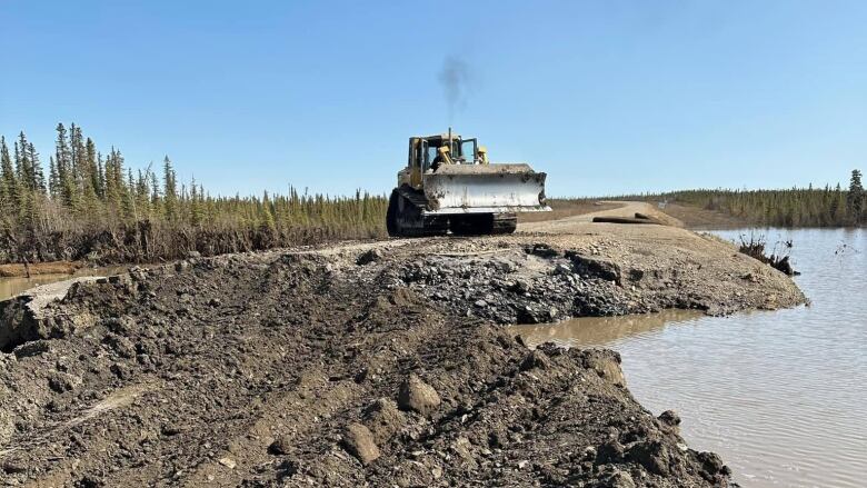 A crew with LJ's Contracting fixes road access to the airport and water and sewage facilities in Fort McPherson, N.W.T.