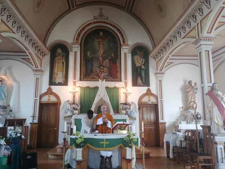 Priests preside over a church service.