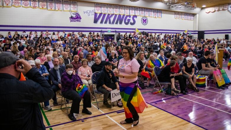 This photo shows a school gymnasium filled with people.