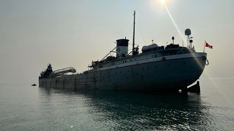 A photo of a large cargo-type ship in water