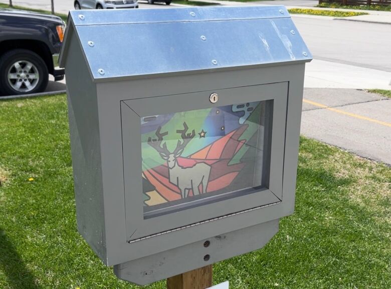 A colourful artwork sits in a locked display case in the community of Livingston.