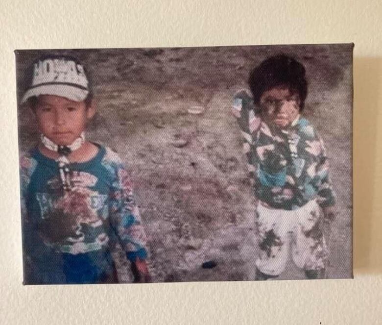 Two kids covered in dirt.