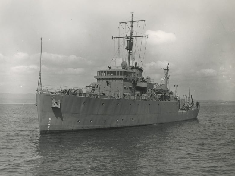 The Canadian minesweeper HMCS Caraquet is shown.