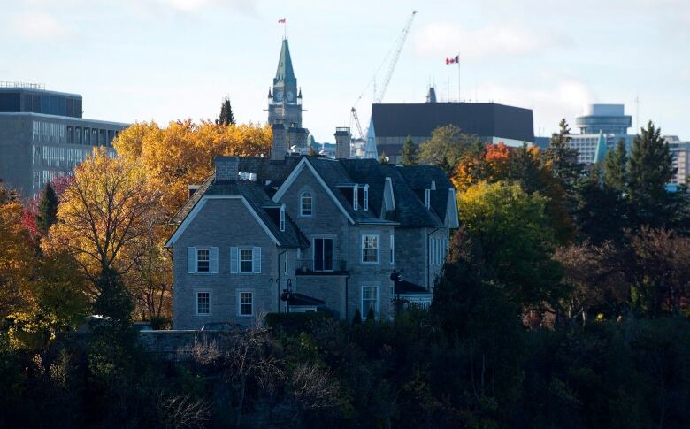 The prime ministers' residence, 24 Sussex, is pictured on a cliff above the Ottawa River.