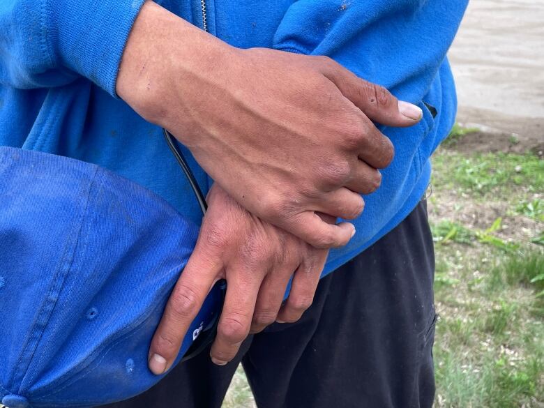 A closeup of a man's hands.