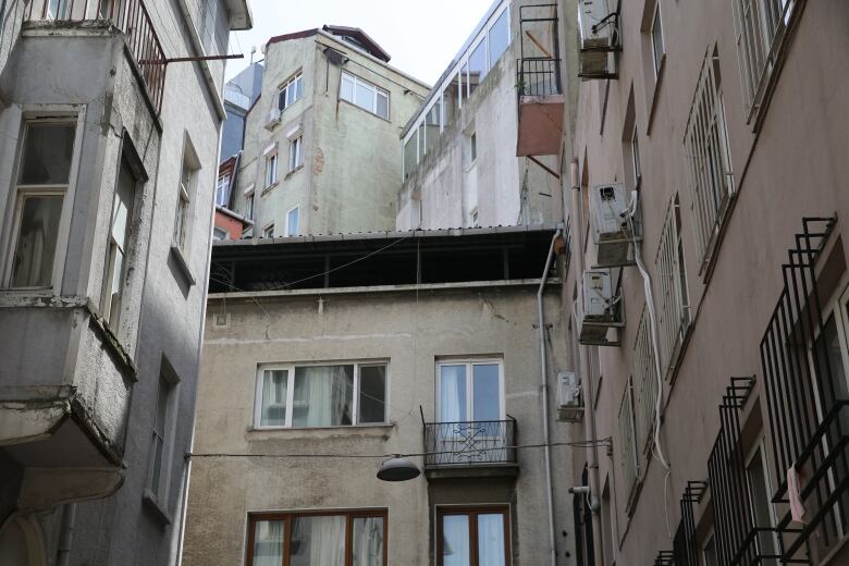 A street lined with apartment buildings.