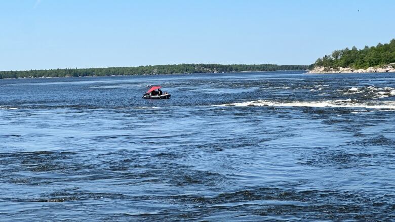 A boat is seen on choppy water.