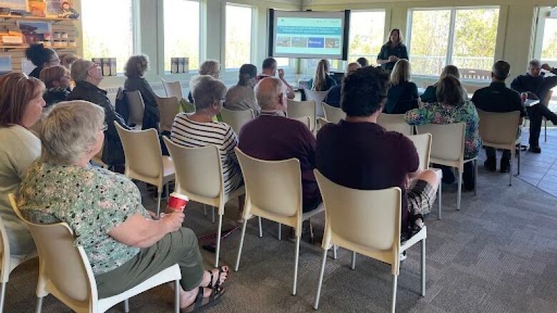 About two dozen people at a public meeting in Cavendish.