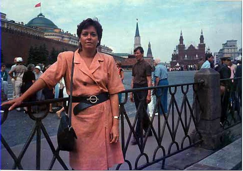 A woman stands in Red Square in Moscow.