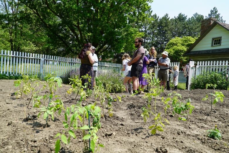 A group of people in a garden.