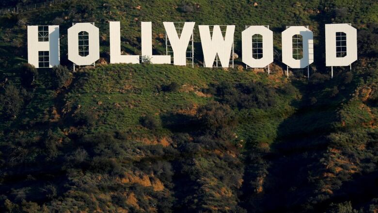 The word 'Hollywood' is spelled out in big, block letters on a hillside.