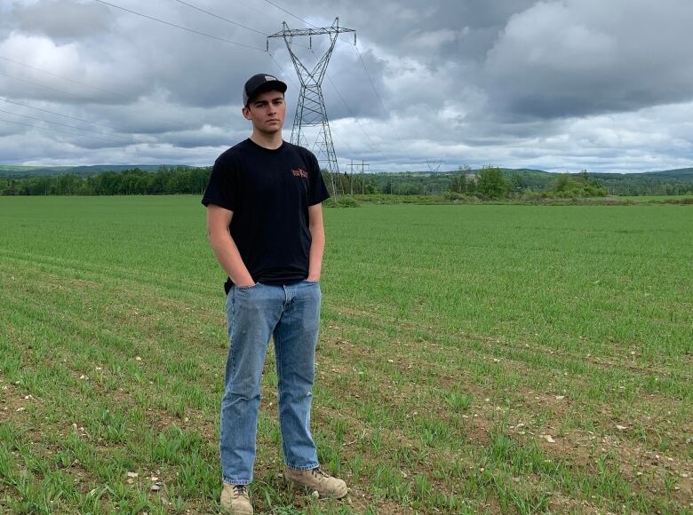 A man standing in a green field