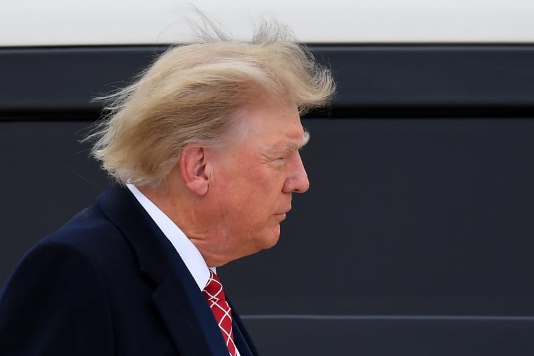 Former U.S. president Donald Trump walking at Scotland's Aberdeen airport.