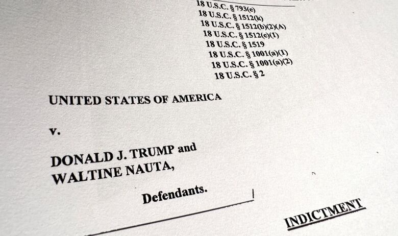 The first page of a charging document against Donald Trump and Walt Nauta.