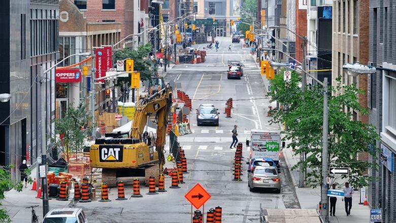 Aerial (drone) images of road Construction on Blue Jays Way and Wellington St W. Shots of condo construction and Toronto Skyline and Spadian Ave