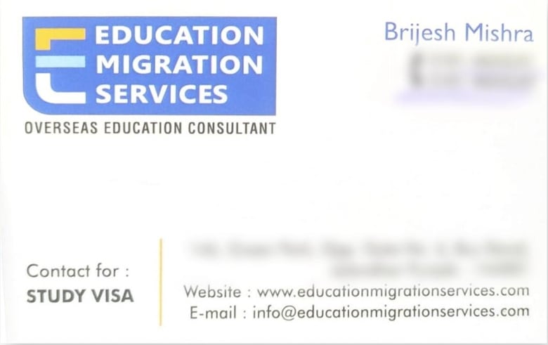 A business card for Education Migration Services.