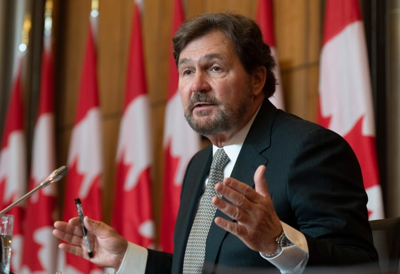 Supreme Court of Canada Chief Justice Richard Wagner gestures as he responds to a reporters question.