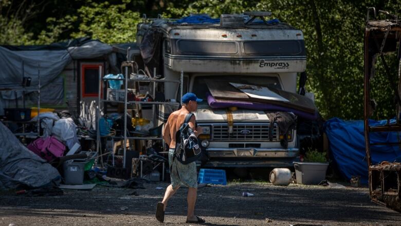 Burned out RVs are pictured at the homeless encampment near Lonzo Road in Abbotsford, British Columbia, on Monday, May 29, 2023. 