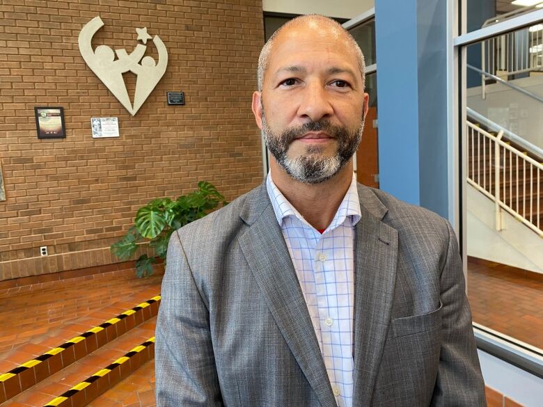 STANDING IN LOBBY OF SCHOOL BOARD OFFICE