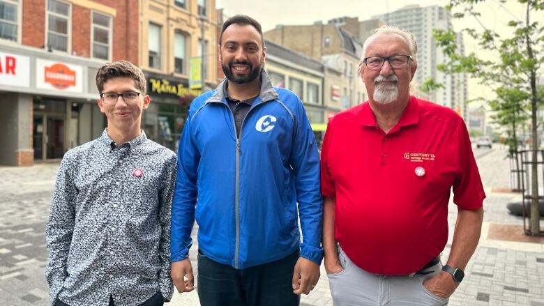 Three federal candidates pose for a photo