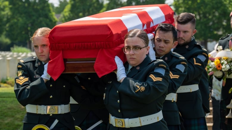 Members of the Canadian Armed forces dressed in formal uniform shoulder a casket carry WW1 solider Harry Atherton.