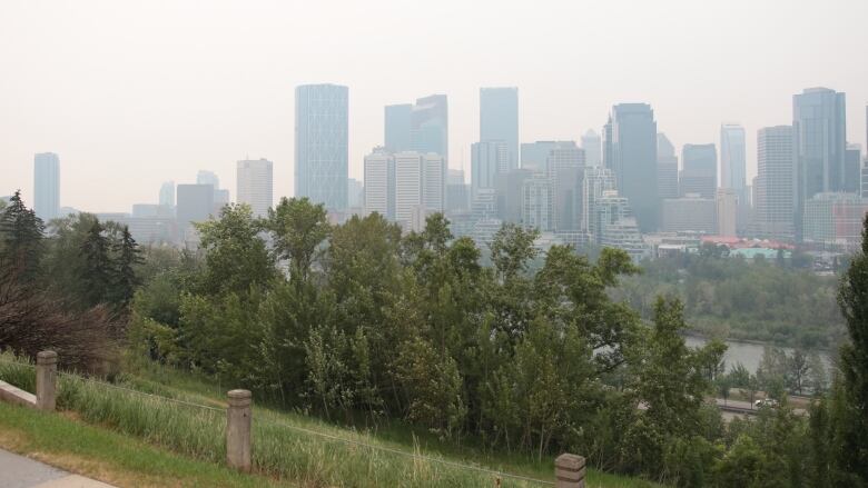 Buildings in downtown Calgary are shrouded in smoke from wildfires. 