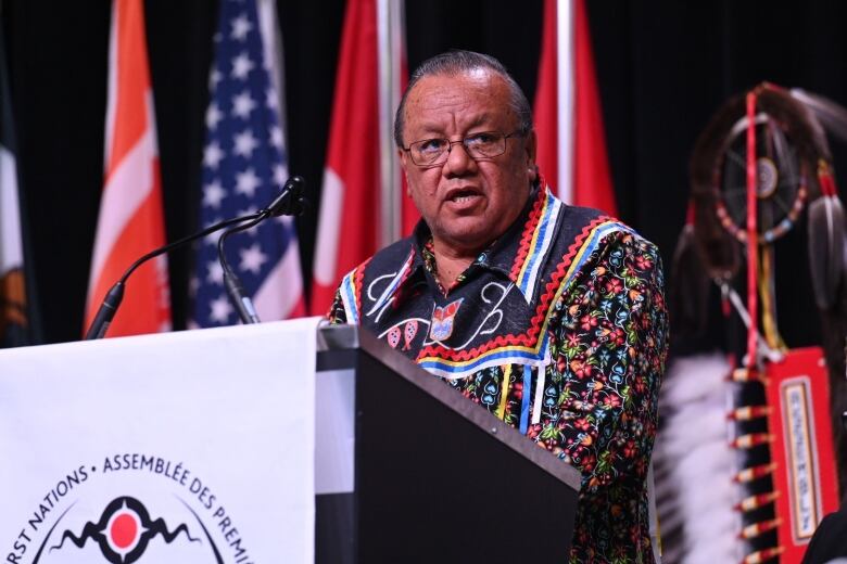 A politician speaks at a podium.