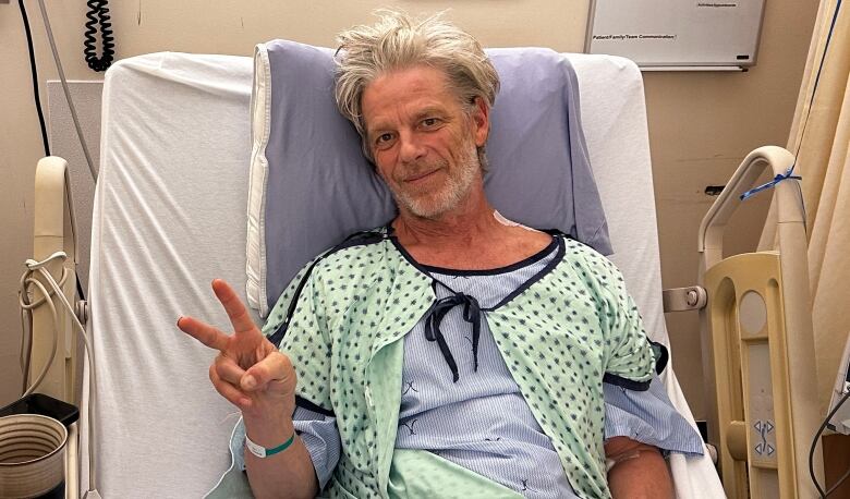 Peter Kirkegaard lays in a hospital bed following emergency surgery. 