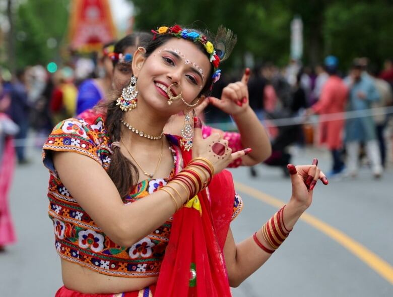 A young woman in brightly coloured traditional clothing