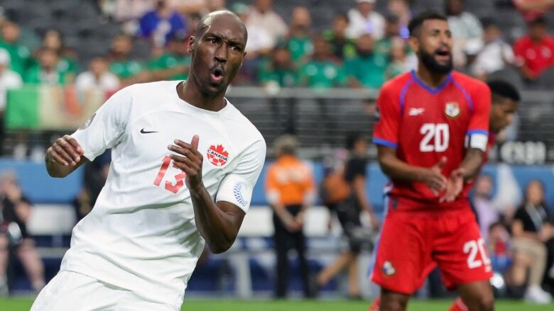 Atiba Hutchinson wears an all white Canada Soccer kit and reacts to a missed shot in Concacaf Nations League in a match against Panama.