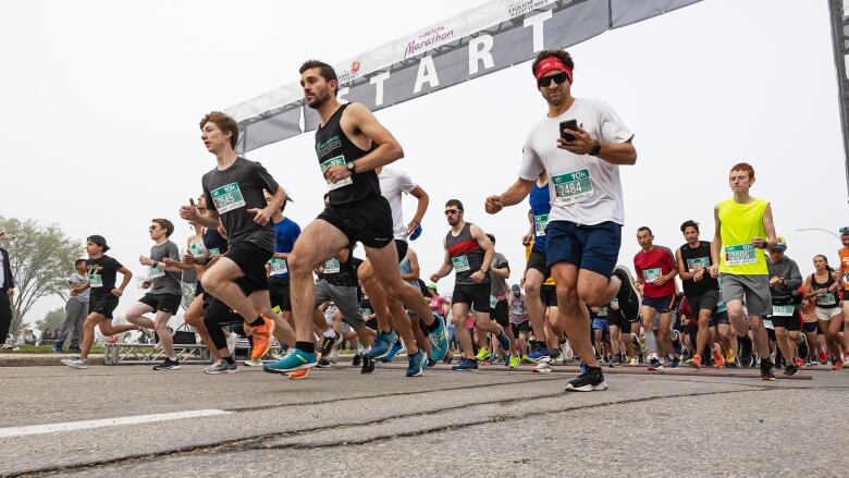 Many runners head off from the starting line.