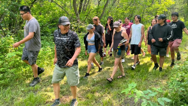 Students and program advisor Gary Gott research plants 