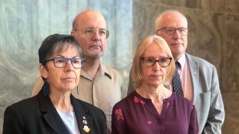 Two women and two men pose for a photo.