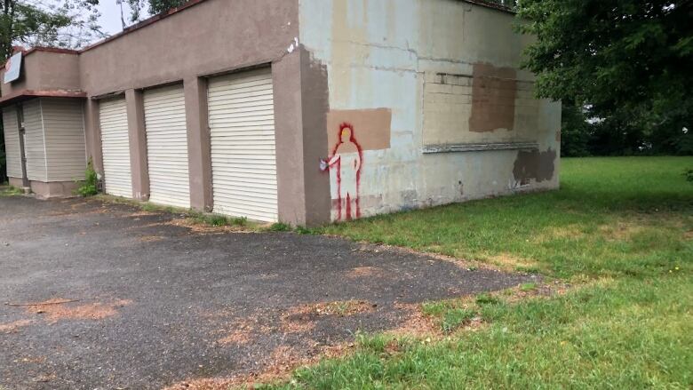 Graffiti, featuring a silhouette with a thumbs up, has been popping up around Windsor  from Sandwich to Riverside. 