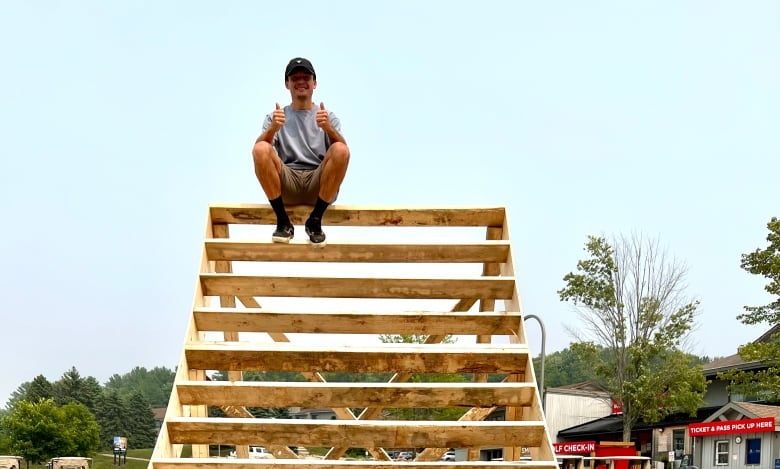 Brayden Barrett-Hay sitting on the slopestyle course he helped design. 