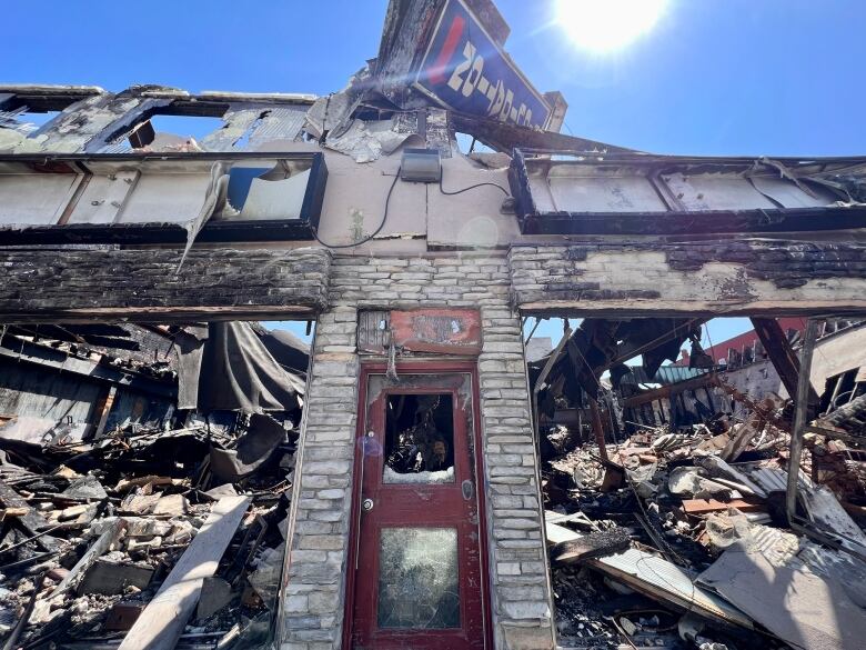 A close up shot of a partially destroyed brick building. 